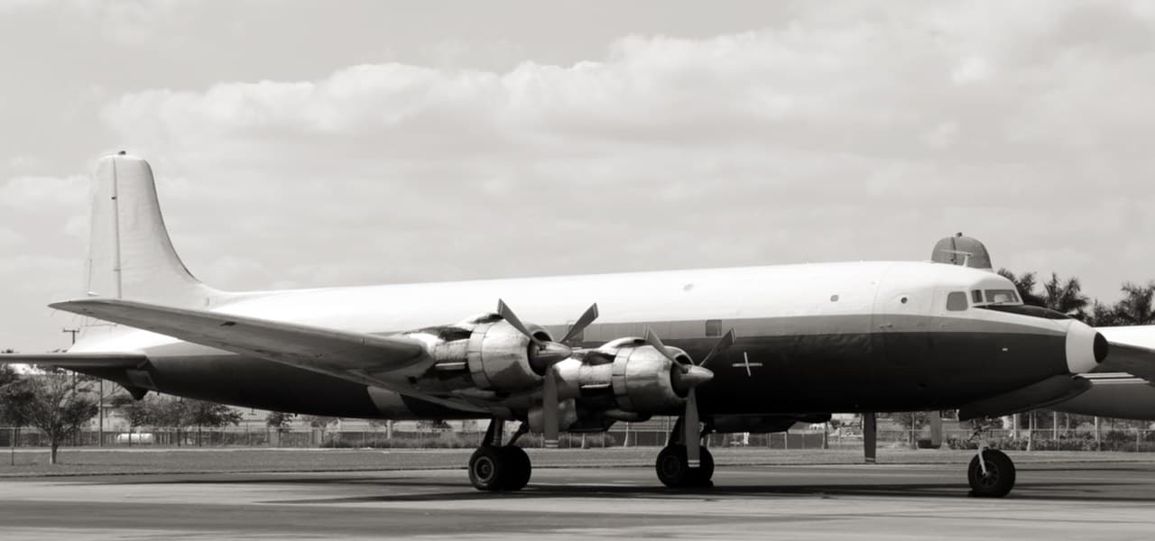 Vintage airliner from the 50s on the ground in black and white